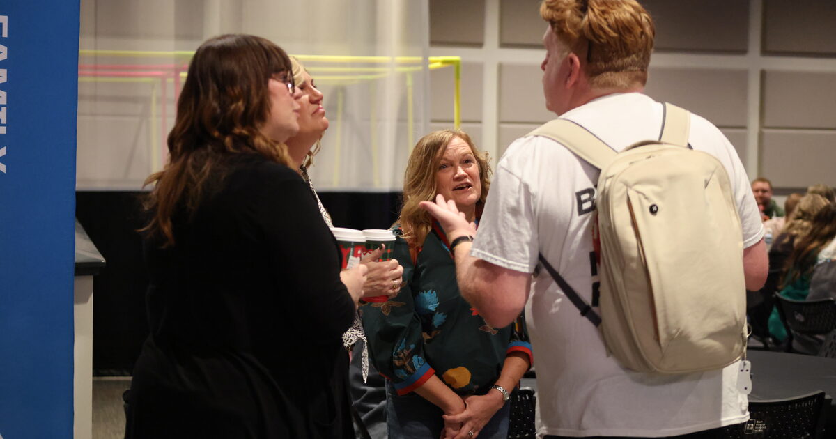 A group of church volunteers talking together before a service