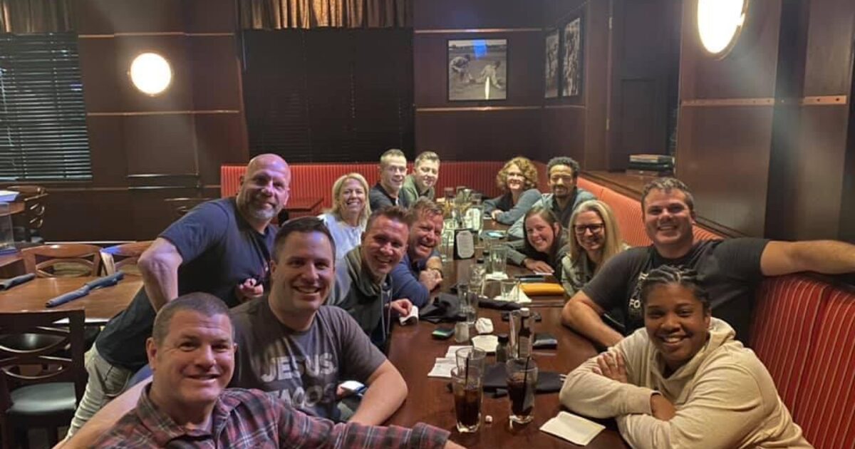 A ministry team sharing a meal together in celebration