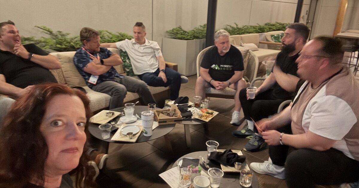 A ministry team sharing a meal and conversation together
